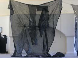 More torn black scrim