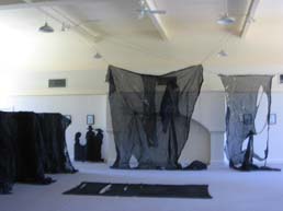 Torn black scrim as part of the stage set