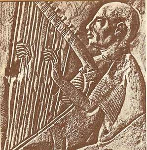 Egyptian bas relief of a man playing a stringed instrument
